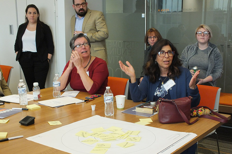 Bank employees talking at a workshop